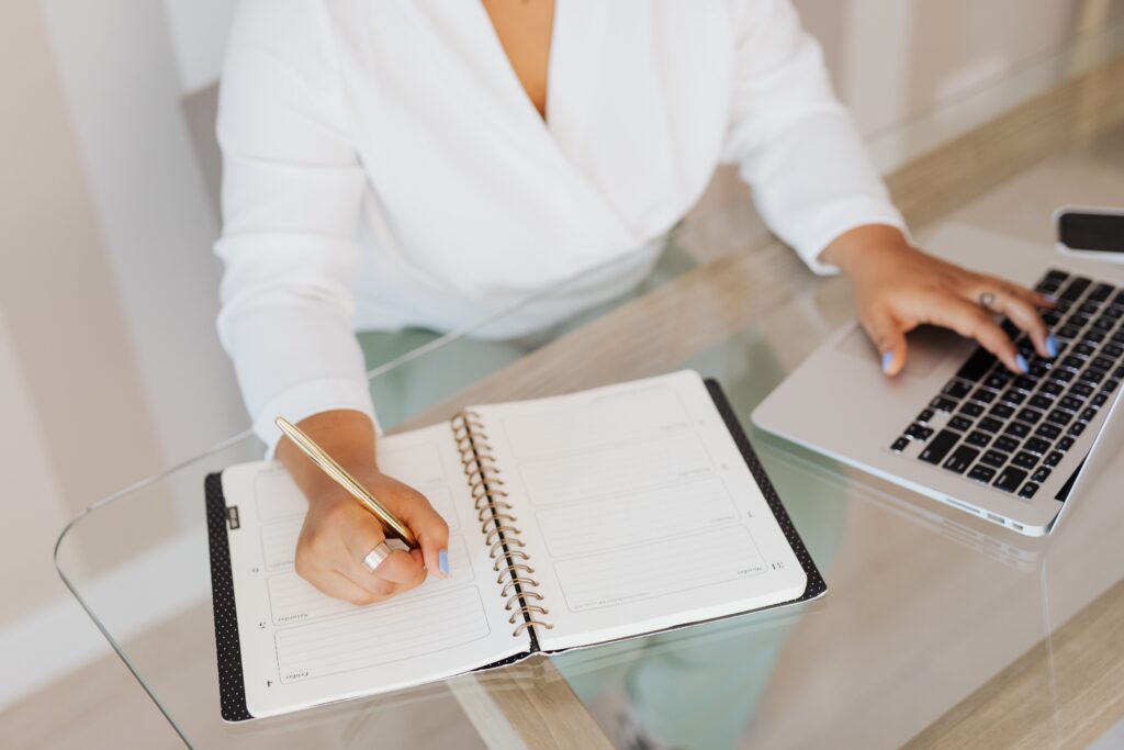Professional planning daily priorities and organizing tasks to improve productivity and workplace performance